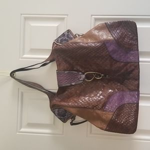 Jessica Simpson shoulder bag. Cognac purple and animal print. Brass accents.